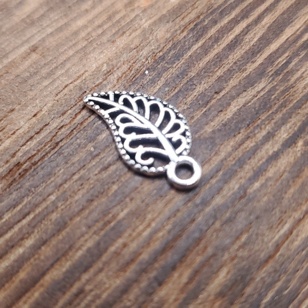 Silver lattice leaf charm pendant